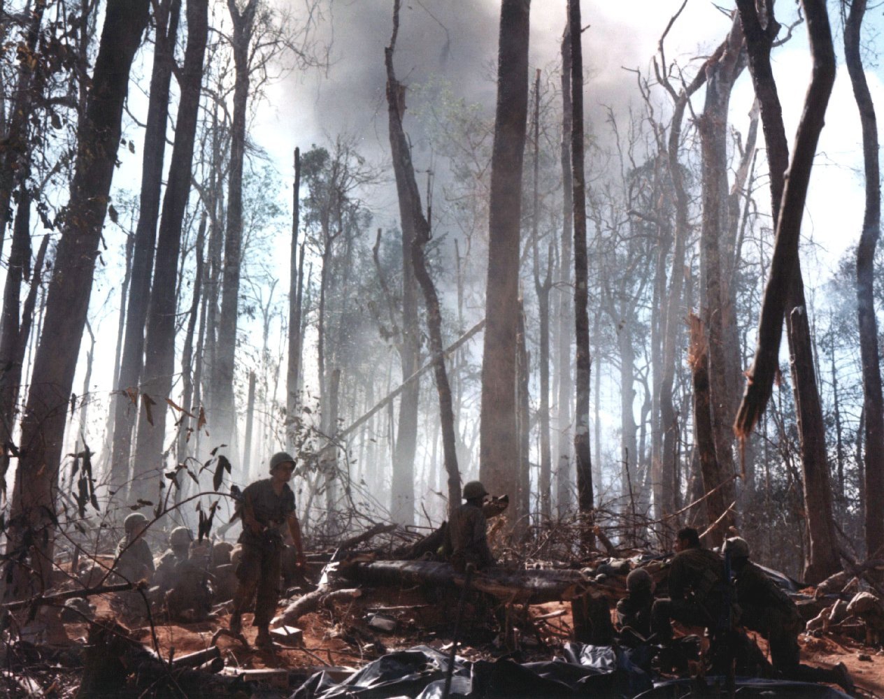 American soldiers on a bare, shattered hilltop