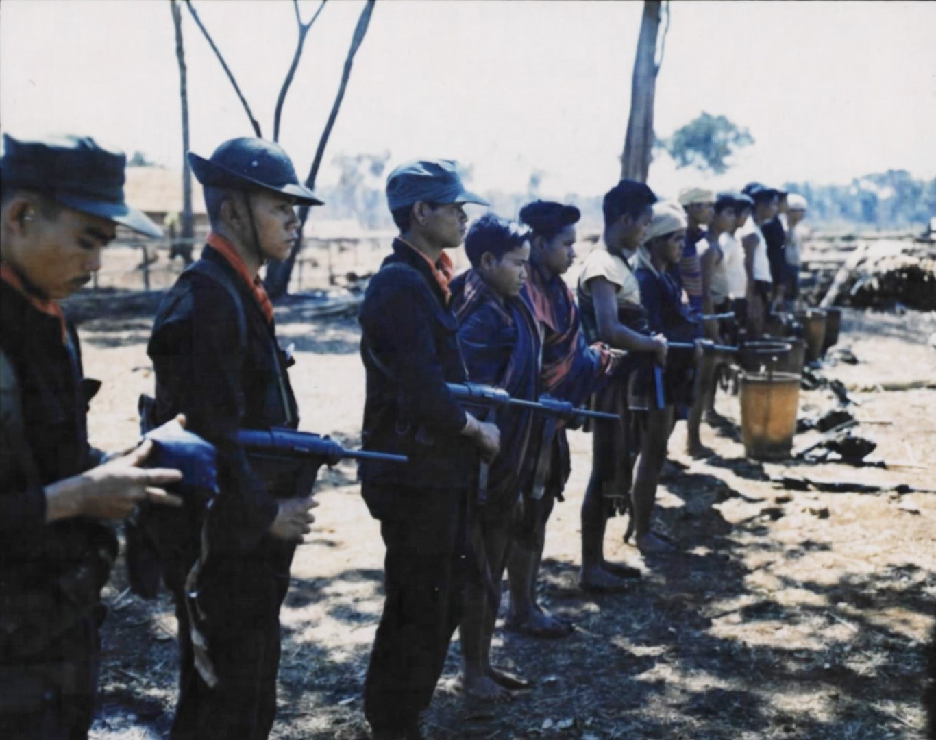 Highland soldiers in fatigues with rifles lined up before a patrol