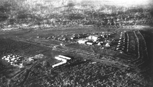 Aerial photograph of a triangular fortified camp on open ground