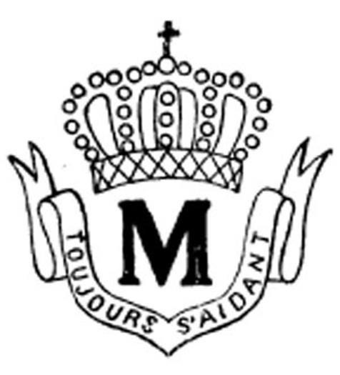 A crowned monogram M with the words Deh Sedang
