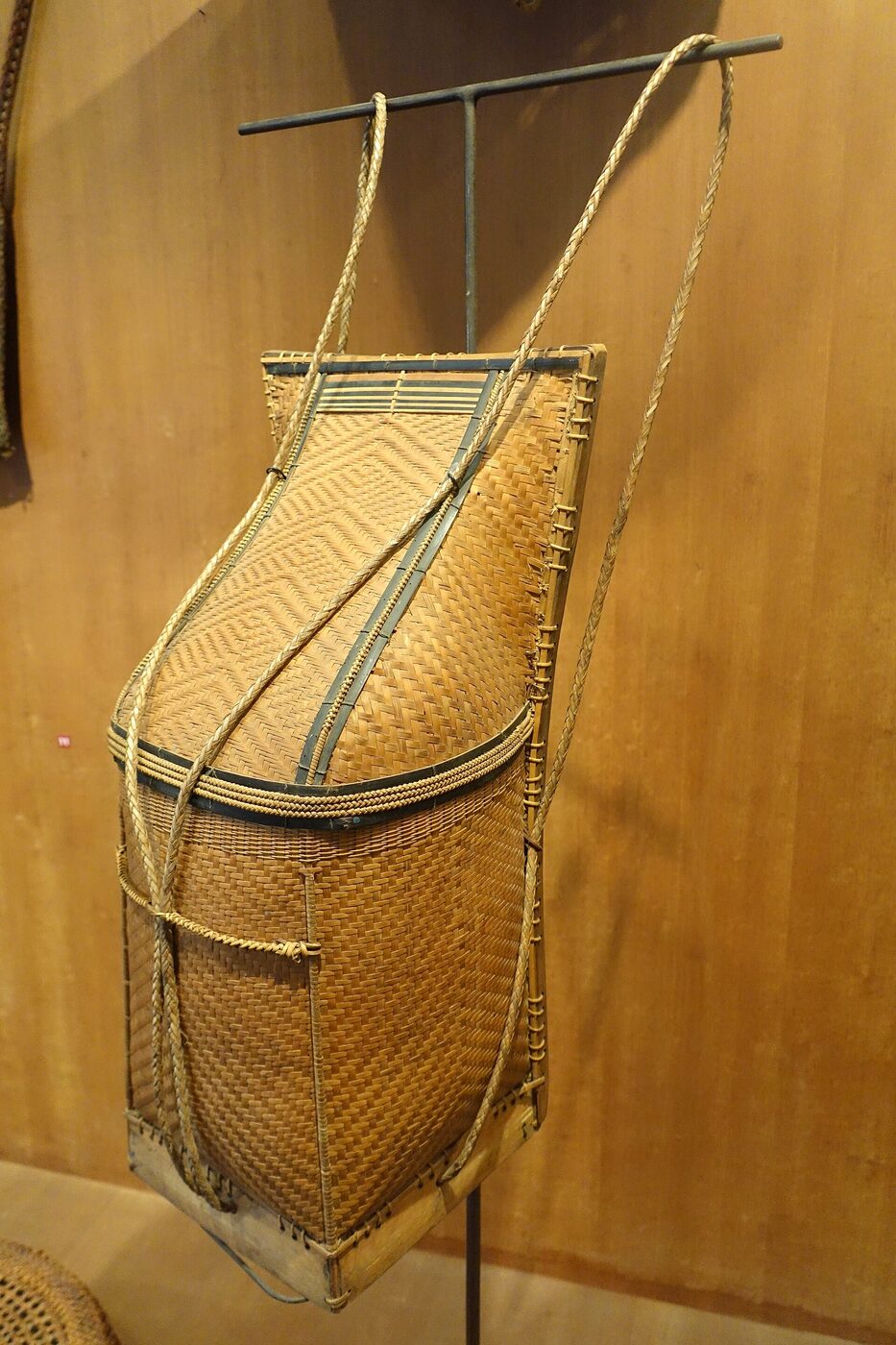 A woven man's shoulder basket